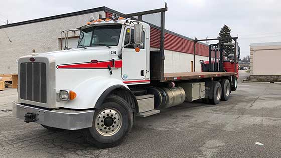 Moffett M8 55.3-12 Forklift and Peterbilt 365 Truck for Sale